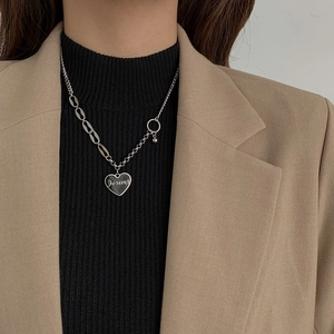Silver stainless steel heart necklace with Forever engraving on a stylish metal chain