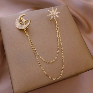 Elegant gold crescent moon and star brooch with sparkling zircon and delicate chains