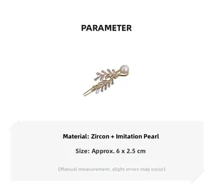 Detailed view of leaf hair clip with zircons and pearl measuring 6 by 2.5 cm