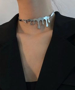 Modern silver lava fluid choker necklace on model with minimalist high-end style