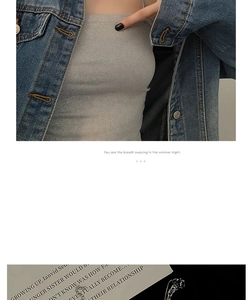 Detail view of multilayer titanium steel necklace paired with denim jacket for women
