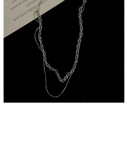 Detail of silver layered titanium steel necklace featuring twisted rope and snake chains