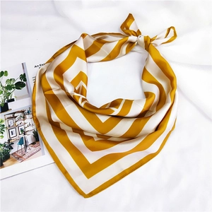 Mustard yellow and white striped square silk scarf tied as an elegant neck accessory
