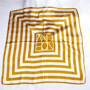 Mustard yellow striped square satin scarf with geometric pattern in flat lay view