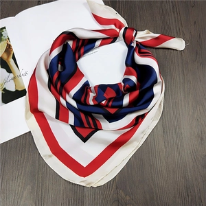 Detailed view of red, white and blue striped silk scarf with elegant glossy texture