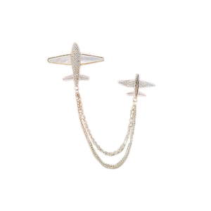 Elegant airplane tassel brooch with double chains and inlaid crystals in gold finish