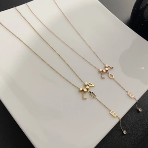 Y-shaped titanium steel LOVE necklaces in gold and rose gold with crystal drop accents