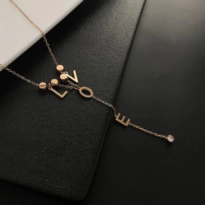 Rose gold LOVE letter titanium necklace with polished beads and diamond pendant accent