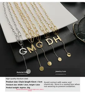 Detailed close-up of titanium steel G, M, C pendants with gold and silver finishes