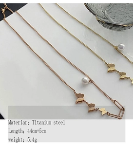 Detail of 18k rose gold butterfly necklace with pearl and titanium steel chain dimensions