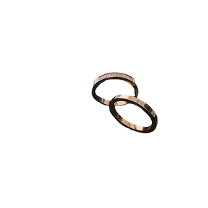 Set of two rose gold titanium steel rings with Roman numerals and cubic zirconia diamonds