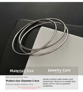 Macro shot of silver triple-ring titanium steel bangle with 5.6cm diameter size details