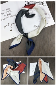 Detailed view of square silk scarf with color-block patchwork and satin luster texture