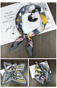 Detail of silk square scarf featuring geometric color blocks and polka dot pattern