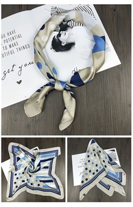 Detail of silk-like satin square scarf with geometric dots and stripes pattern
