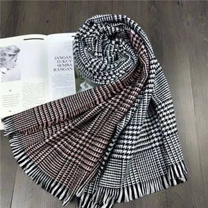 Classic houndstooth scarf in pink, black and white with elegant fringed edges