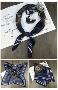 Detail of navy silk scarf with gold chain pattern and white stripes in three-grid layout