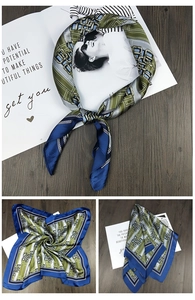 Close-up of olive and navy square silk scarf with classic chain pattern and striped detail