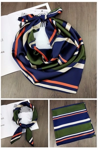 Detailaufnahme des retro-gestreiften Seidensatin-Quadrattuchs in Marine, Grün und Orange