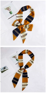 Detail of a striped narrow silk scarf showing bow-knot styling on a white background