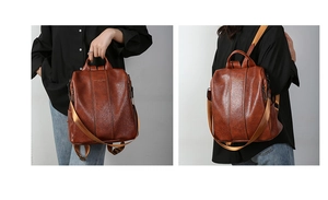 Detail view of brown vintage PU leather backpack with adjustable woven straps and logo