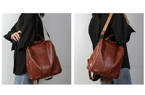Detailed view of deep brown leather backpack with retro texture and fashion logo