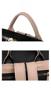Détail de la poignée élégante et des coutures renforcées sur un sac à dos bicolore