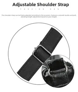 Detail of adjustable black leather shoulder strap with silver buckle and D-ring connector