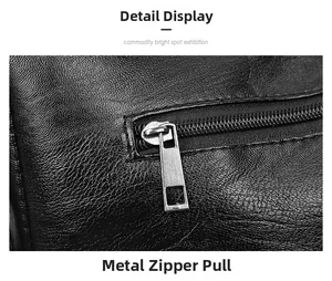 Detailed macro view of the premium metal zipper and hardware on the black leather handbag