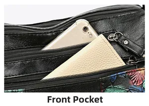 Front pocket detail of black leather crossbody bag showing spacious interior for essentials