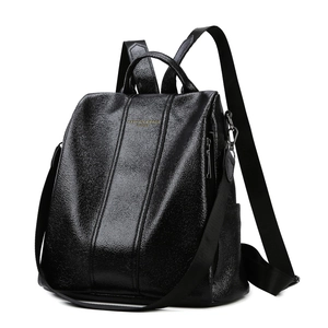 Minimalist black faux leather anti-theft backpack for women with golden lettering detail