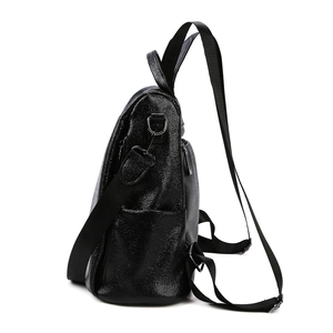 Minimalist black lychee texture leather anti-theft backpack for women shown from side