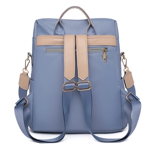 Sac à dos bleu gris moderne avec bretelles beiges et poche zippée de sécurité au dos