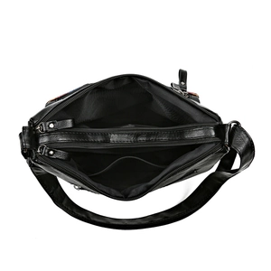 Black faux leather crossbody bag with multiple zippers and spacious inner compartments