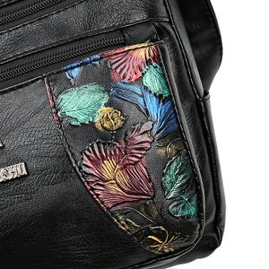 Litchi pattern leather handbag with colorful embossed floral design and multi-zipper detail