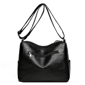 Black pebbled leather crossbody bag with multiple zip pockets and adjustable strap
