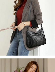 Detail der schwarzen PU-Leder Handtasche mit mehreren Reißverschlüssen und gesteppten Nähten