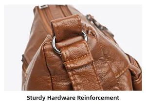 Detail der silbernen Metallschnalle und verstärkten Hardware an brauner Ledertasche