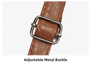 Detail of adjustable metal square buckle on brown litchi grain leather shoulder strap