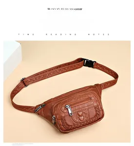 Detail of brown leather waist bag featuring heart embossed pattern and zip pockets