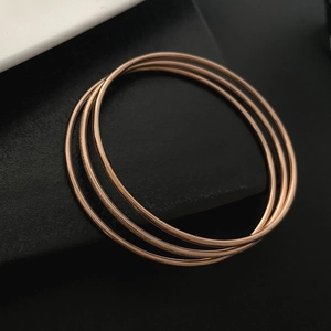 Three-piece rose gold stackable titanium steel bracelets with polished and frosted finish