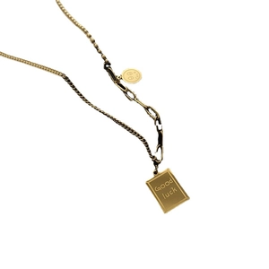 Vintage gold layered necklace with Good Luck engraved pendant and smiley face charm
