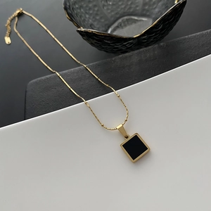 Gold-plated titanium steel necklace with a geometric square black onyx pendant
