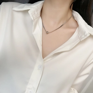 Minimalist silver spherical pendant necklace on elegant snake chain for women