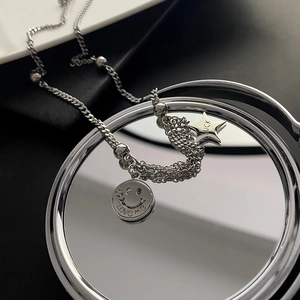 Silver smile face and star charm necklace in titanium steel with polished finish
