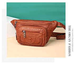Close-up of brown vintage leather waist bag with double heart stitching and zippers