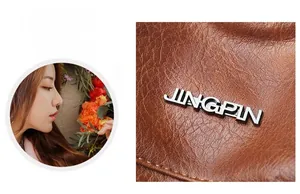 Vue macro du cuir PU marron avec motif litchi et détails du logo JINGPIN en métal