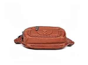 Detailed bottom view of brown pebble leather fanny pack with neat stitching crafts