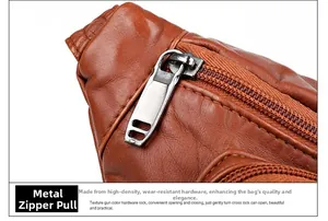 Detail of lychee pattern soft leather bag showing the durable gunmetal zipper puller