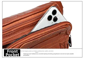 Detail of brown lychee leather waist bag featuring front zip pocket for smartphones